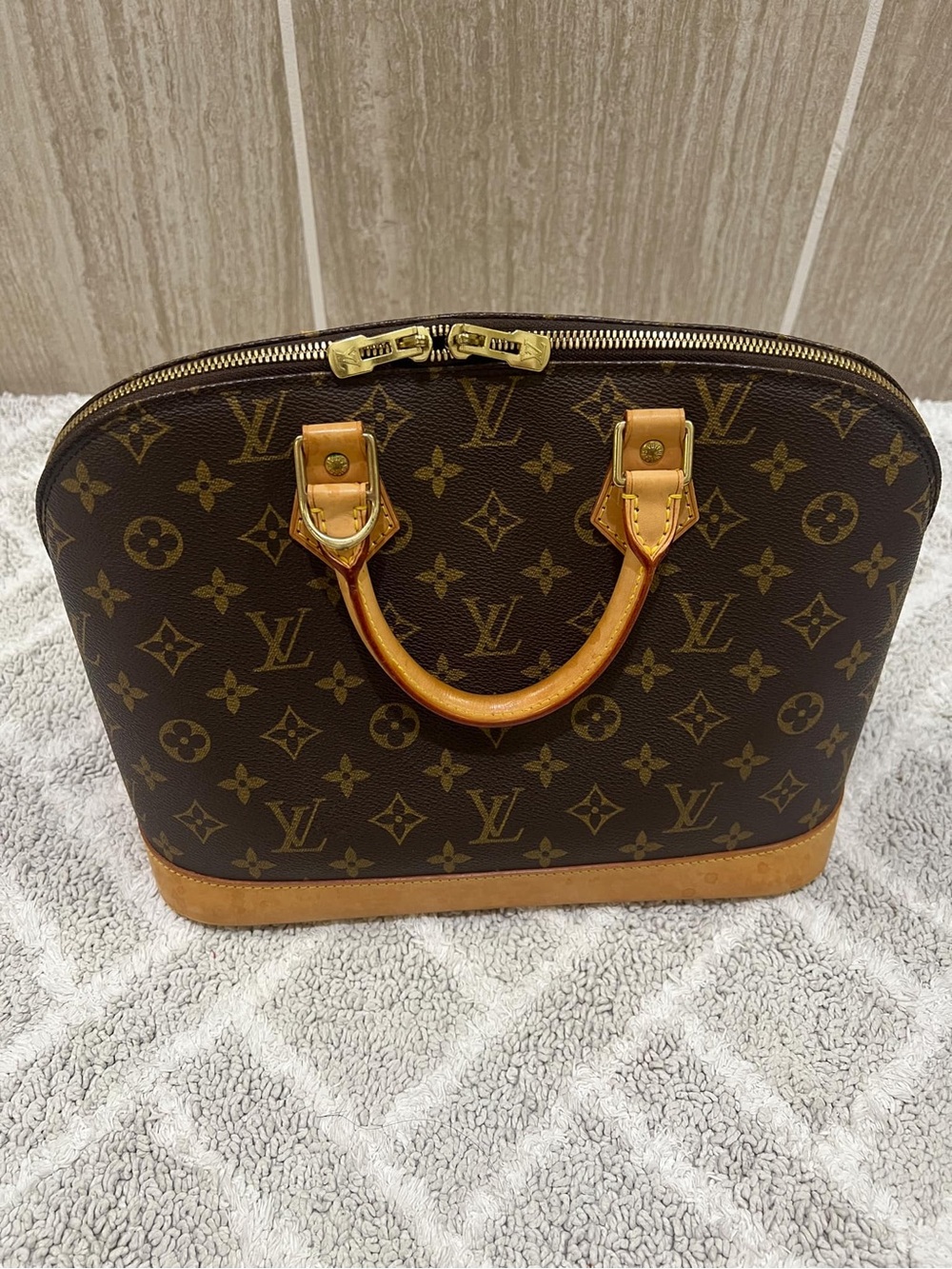 Louis Vuitton Brown Monogram Alma Satchel with Vachetta Trim
